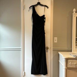Long black dress. Never been worn with original price tag.